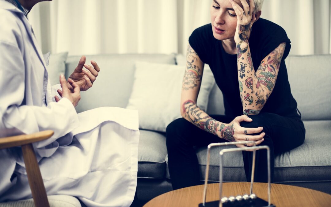 Depressed woman having a counseling session Depressed woman having a counseling session